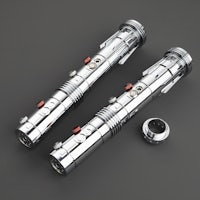 two star wars lightsabers on a grey surface